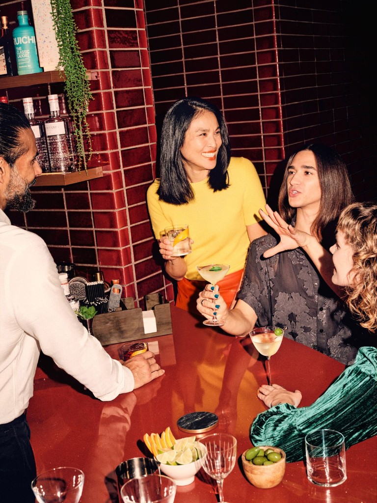 Guests ordering drinks at a bar counter