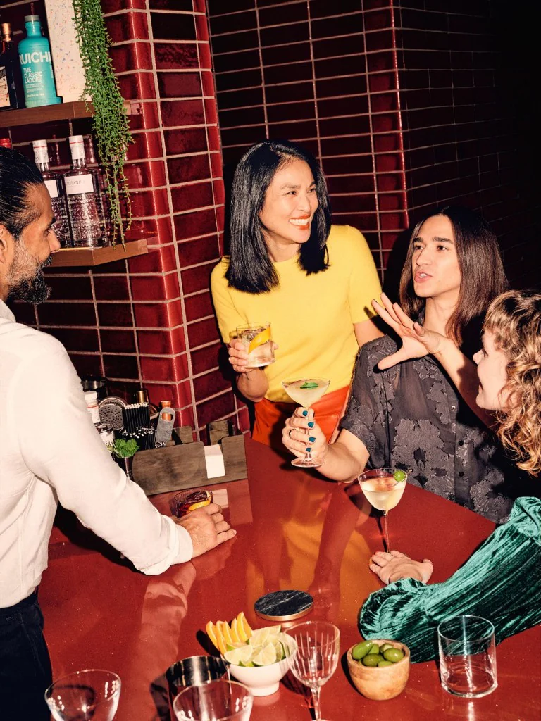 Guests ordering drinks at a bar counter