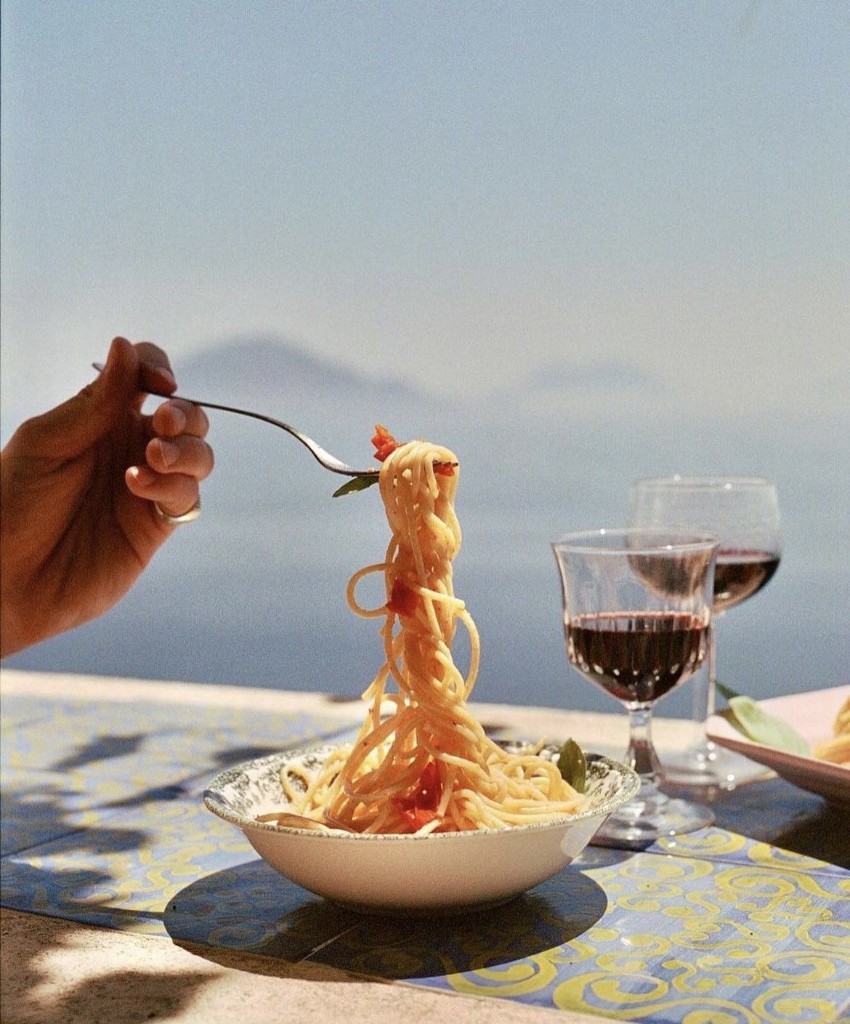 Plate of pasta served on a terrace table